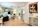 Bright and airy living room with seamless access to kitchen, promoting an easy flow for modern living and entertaining at 966 N Ronald Reagan Blvd, Longwood, FL 32750