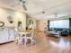 Well-lit living room with a dining area, comfortable seating and a versatile space for relaxation and socializing at 966 N Ronald Reagan Blvd, Longwood, FL 32750