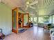 Spacious sunroom featuring tile floors, a ceiling fan, and glass doors leading to other areas of the home at 966 N Ronald Reagan Blvd, Longwood, FL 32750
