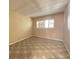 Vacant bedroom featuring a window with blinds and neutral walls at 501 W Old Us Highway 441 # C201, Mount Dora, FL 32757