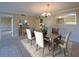 An airy dining room with an open layout featuring stylish decor and ample space for entertaining guests at 501 W Old Us Highway 441 # C201, Mount Dora, FL 32757