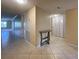 Spacious entryway with tile flooring, console table, and neutral walls at 501 W Old Us Highway 441 # C201, Mount Dora, FL 32757