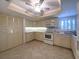 Charming kitchen with ample cabinets, tile floors, and updated appliances at 501 W Old Us Highway 441 # C201, Mount Dora, FL 32757