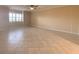A large living room with neutral paint, tile floors, and bright natural light at 501 W Old Us Highway 441 # C201, Mount Dora, FL 32757