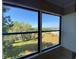 Screened lanai featuring a beautiful view of the landscaped yard and lake at 501 W Old Us Highway 441 # C201, Mount Dora, FL 32757