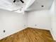 Simple bedroom with hardwood floors and neutral decor at 155 S Court Ave # 2107, Orlando, FL 32801