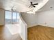 Spacious living area with hardwood floors and partial wall at 155 S Court Ave # 2107, Orlando, FL 32801