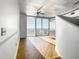Sunlit living area with hardwood floors and city views at 155 S Court Ave # 2107, Orlando, FL 32801