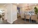 Elegant dining room with a chandelier and seating for six at 14 Weston Rd, Leesburg, FL 34748