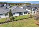 Home's backyard with grassy area and hedge at 3016 Kensington Ave, Davenport, FL 33837