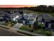 Modern homes at dusk with landscaped yards at 3016 Kensington Ave, Davenport, FL 33837