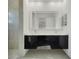 Double vanity bathroom with modern fixtures and large mirror at 3016 Kensington Ave, Davenport, FL 33837