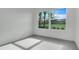 Spacious bedroom with large window and view of backyard at 3016 Kensington Ave, Davenport, FL 33837