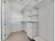 Spacious closet with ample shelving and hanging rods at 3016 Kensington Ave, Davenport, FL 33837