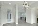 Modern entryway with glass front door and grey tile floors at 3016 Kensington Ave, Davenport, FL 33837