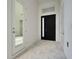 Modern entryway with glass door and tile floor at 3016 Kensington Ave, Davenport, FL 33837