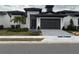 Move-in ready home with a two-car garage and landscaped yard at 3016 Kensington Ave, Davenport, FL 33837