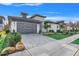Modern home with gray garage door and landscaped yard at 3016 Kensington Ave, Davenport, FL 33837