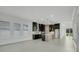 Open concept kitchen with modern island and black cabinetry at 3016 Kensington Ave, Davenport, FL 33837