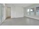 Bright and spacious living room with grey tile flooring and sliding glass doors at 3016 Kensington Ave, Davenport, FL 33837