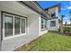 Modern patio with sliding glass doors and view of the backyard at 3016 Kensington Ave, Davenport, FL 33837