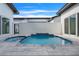 Private pool and spa with tiled accents and spacious patio at 3016 Kensington Ave, Davenport, FL 33837