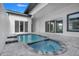 Private pool and spa with tiled accents and spacious patio at 3016 Kensington Ave, Davenport, FL 33837
