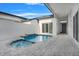 Private pool and spa with tiled accents and spacious patio at 3016 Kensington Ave, Davenport, FL 33837