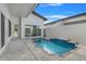 Private pool and spa with tiled accents and spacious patio at 3016 Kensington Ave, Davenport, FL 33837