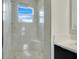Large walk-in shower with pebble floor and built-in seat at 3016 Kensington Ave, Davenport, FL 33837