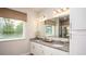 Modern bathroom with double vanity and a large mirror at 2231 Elegant Manor Cir, Edgewater, FL 32141