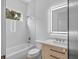 Bathroom featuring a bathtub, shower, modern vanity with sink, and lit mirror at 260 Deer Isle Dr, Winter Garden, FL 34787