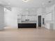 Modern kitchen features sleek black and white cabinetry, stone countertops, and stainless steel appliances at 260 Deer Isle Dr, Winter Garden, FL 34787
