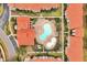 Directly above view of resort-style pool and surrounding buildings at 904 Charo Pkwy # 518, Davenport, FL 33897