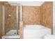 Bathroom with shower and bathtub, featuring tile surround at 904 Charo Pkwy # 518, Davenport, FL 33897