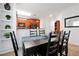 View of dining area with a table and six chairs, adjacent to kitchen at 904 Charo Pkwy # 518, Davenport, FL 33897