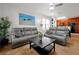 Living room with gray couches and a coffee table at 904 Charo Pkwy # 518, Davenport, FL 33897