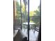 Cozy balcony featuring a table and chairs, perfect for enjoying the outdoor view at 12521 Floridays Resort Dr # 302F, Orlando, FL 32821