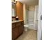 The bathroom features a shower-tub, vanity, toilet, and tiled floor at 12521 Floridays Resort Dr # 302F, Orlando, FL 32821