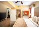 Relaxing bedroom with ceiling fan, decorative pillows and accents, and adjoining bathroom access at 12521 Floridays Resort Dr # 302F, Orlando, FL 32821