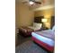 The bedroom features 2 double beds with accent lamps, bedside tables and soft lighting at 12521 Floridays Resort Dr # 302F, Orlando, FL 32821