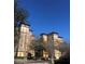 View of building's exterior showcasing its architectural features and design, and a clear blue sky backdrop at 12521 Floridays Resort Dr # 302F, Orlando, FL 32821