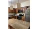 Well-equipped kitchen with stainless steel appliances, granite countertops, and ample cabinet space at 12521 Floridays Resort Dr # 302F, Orlando, FL 32821
