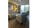 Inviting living room featuring a sofa, chairs, and balcony access, offering a relaxing space at 12521 Floridays Resort Dr # 302F, Orlando, FL 32821