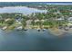 Lakefront property with lush landscaping and multiple homes at 800 W 2Nd Ave, Windermere, FL 34786