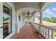 Covered balcony with terracotta tile flooring and arched columns at 800 W 2Nd Ave, Windermere, FL 34786