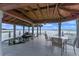 Covered boat port with seating area and lake view at 800 W 2Nd Ave, Windermere, FL 34786