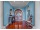Elegant entryway with hardwood floors and arched doorway at 800 W 2Nd Ave, Windermere, FL 34786