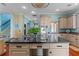 Kitchen island with granite countertop and stainless steel appliances at 800 W 2Nd Ave, Windermere, FL 34786