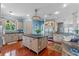 Island kitchen with granite countertops and stainless steel appliances at 800 W 2Nd Ave, Windermere, FL 34786
